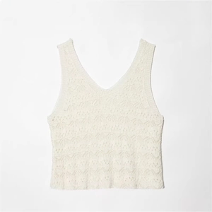 Sleeveless white V-neck crochet knit midi dress with intricate wave texture