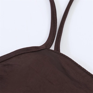 Close-up of the fine stitching and dark brown satin fabric texture on the shoulder strap