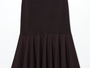 Detail showing the pleated hem and seamless stitching on this dark slim dress