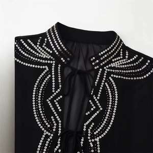 Women's chic black semi-sheer shirt with silver sequins, beads and tie-neck detail