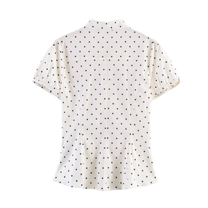 Back view of a white poplin top with black polka dots and stylish bow detail