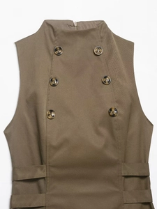 Close-up of double-breasted brown vest with tortoiseshell buttons and textured twill fabric