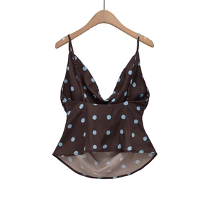 Brown spaghetti strap camisole with blue polka dots and V-neckline on a white background