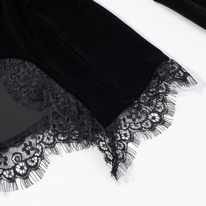 Close-up of black velvet top featuring delicate eyelash lace trim and premium texture