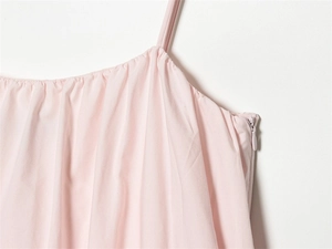 Detail of pink dress featuring delicate pleated neckline and invisible side zipper