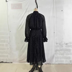French polka dot chiffon dress with high neck, long sleeves and ruffled cuffs in black