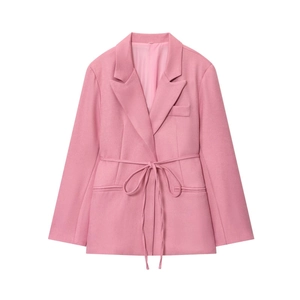 Detail of pink linen blend blazer featuring notched lapels and waist drawstring tie