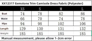 Detailed size chart for the gem-trimmed slip dress including bust, waist, and length