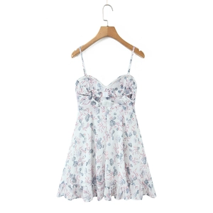Close-up of the elegant open back with elastic ruching and sea shell print detail