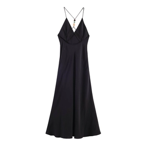 Detail of elegant black satin maxi dress featuring a V-neck and beaded back cross straps