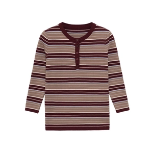 Detailed view of striped long sleeve Henley shirt with buttoned collar and ribbed texture
