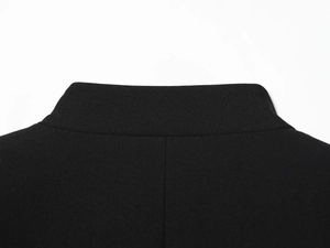 Detailed macro view of the black stand collar and fabric texture of the women blazer