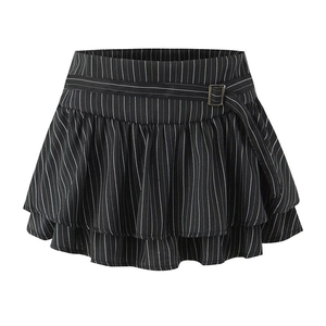 Close-up of black and white striped mini skirt with layered ruffles and belted waist