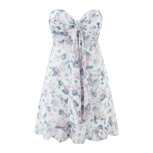 White summer sundress with blue seashell and pink coral print featuring a bow neckline