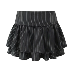Detail of black and white striped mini skirt with layered ruffle hem and wide waistband