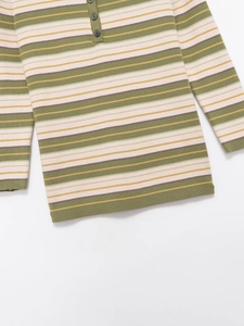 Detailed close-up of a striped long-sleeve knit polo with dark buttons and fine texture