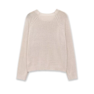 Detail of crew neck knit sweater featuring raglan sleeves and ribbed cuffs in off-white