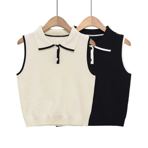 Detail view of slim-fit sleeveless knit vests with contrast trim and polo collars