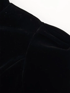 Close-up detail of premium black velvet fabric showing soft texture and elegant sheen