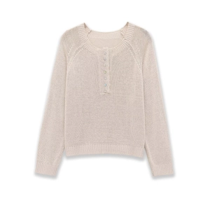 Detail of beige long sleeve knit sweater with colorful buttons on the crew neck collar