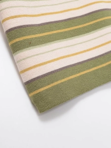 Macro shot of knitted horizontal stripes in olive green, mustard yellow, and cream white
