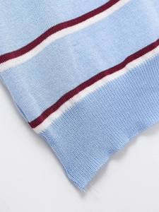 Close-up of blue and red striped knit top featuring fine ribbing and premium texture