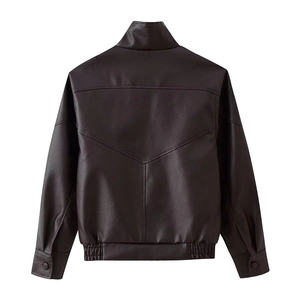 Macro detail of dark brown faux leather jacket back with V-shaped stitching and high collar