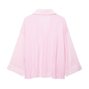 Back view of a loose pink and white striped long sleeve shirt with dropped shoulders