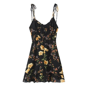 Floral print camisole dress with smocked waist and ruffled hem on white background