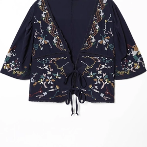 Navy blue V-neck crop top with colorful ethnic floral embroidery and tie-front closure