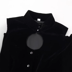 Elegant black velvet top with puff sleeves, mandarin collar, and stylish chest cutout