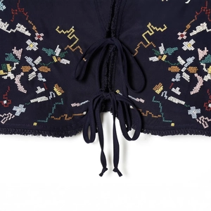 Bohemian dark blue cropped top with floral embroidery, lace-up front and tassel fringe hem