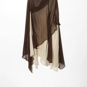 Asymmetrical tiered polka dot skirt in brown and cream with a layered chiffon design