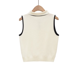 Slim-fit sleeveless knit vest in cream with contrast black trim and ribbed hem detailing