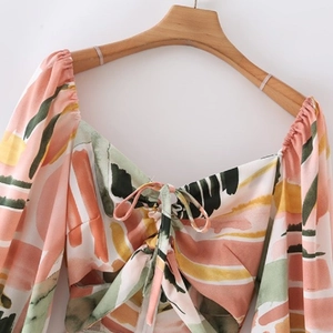 Women's summer floral print dress with V-neck tie detail and vibrant watercolor pattern