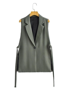 Detail view of women's sleeveless blazer vest with notched lapels and side ribbon accents