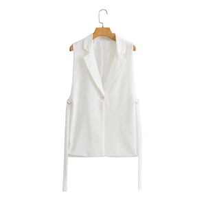 Detail view of white sleeveless blazer vest with lapel collar and side drawstring ties