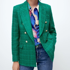 Green tweed blazer with double-breasted buttons and classic notched lapels for women