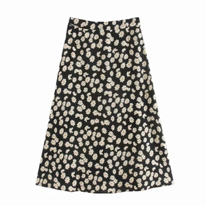 Schwarzer Midi-Rock mit hoher Taille und weiß-gelbem Gänseblümchen-Print in A-Linie Form