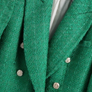 Classic green tweed blazer featuring double-breasted metal crest buttons and lapel collar