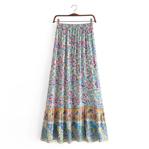 Detail of bohemian floral print maxi skirt showing elastic waist and ruffled hemline