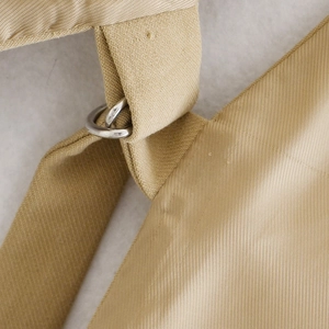 Women's sleeveless vest with lapel collar featuring a khaki twill fabric and D-ring buckle detail