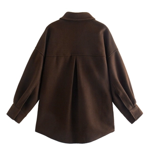 Detail view of the brown button-down coat back with drop shoulders and a curved hemline