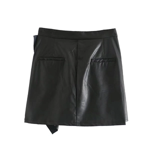Women's black high waist faux leather mini skirt with ruffle trim and asymmetric hem design