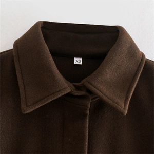Women's deep brown wool shirt jacket with classic lapel collar and XS size label detail