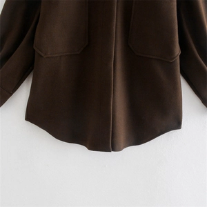 Deep brown woolen jacket with large flap pockets and a curved hemline detail