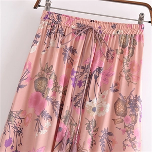 Floral cotton maxi skirt with elastic waist and purple tassels in bohemian style