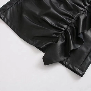 Women's black high waist PU leather mini skirt with ruffle details and ruched texture