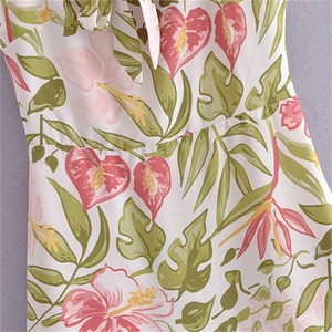 Floral French style mini dress with hibiscus prints, waist seam and bow-tie neckline details