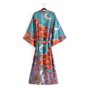 Close-up of rayon floral kimono cardigan showing detailed moon and cloud print patterns